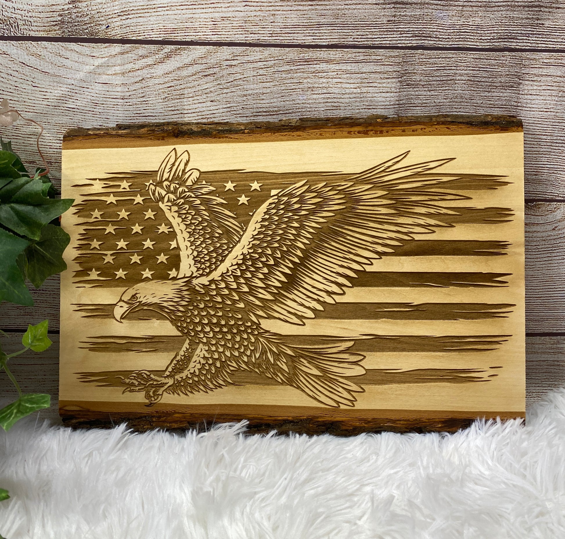 Distressed flag with bald eagle. Laser engraved into live edge wood. Comes ready to hang.